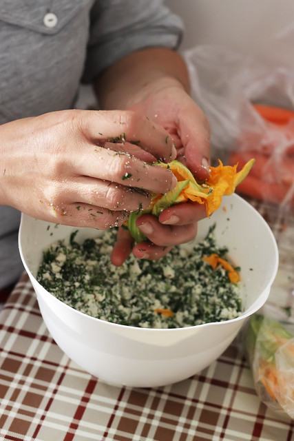 Stuffing zucchini flowers by Olga Irez